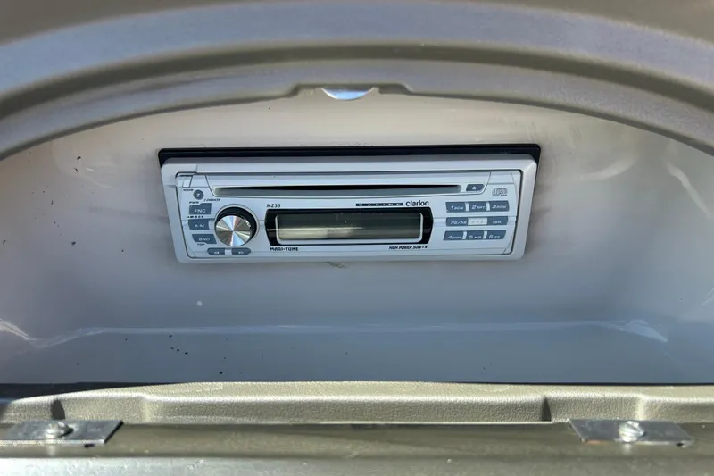 Slide: The Image of Clarion stereo system in 2005 Sea Ray 200 Sport boat dashboard. - 24