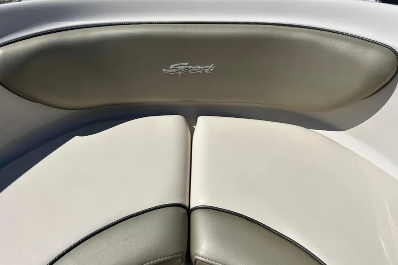 Slide: The Image of 2005 Sea Ray 200 Sport boat interior with "Sport" logo on cushioned seating. - 33