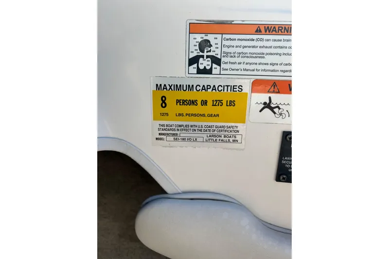 Slide: The Image of 2007 Larson SEi 180 LX I/O boat capacity label, max 8 persons or 1275 lbs. - 11
