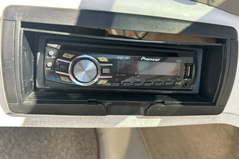 Slide: The Image of Pioneer stereo system in a 2007 Larson SEi 180 LX I/O boat dashboard. - 12