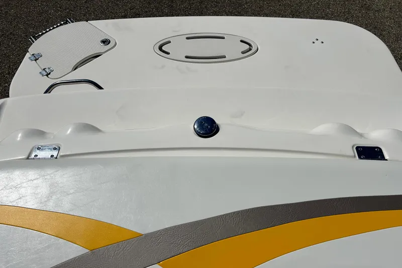 Slide: The Image of 2007 Larson SEi 180 LX I/O boat deck with yellow and gray accents. - 14