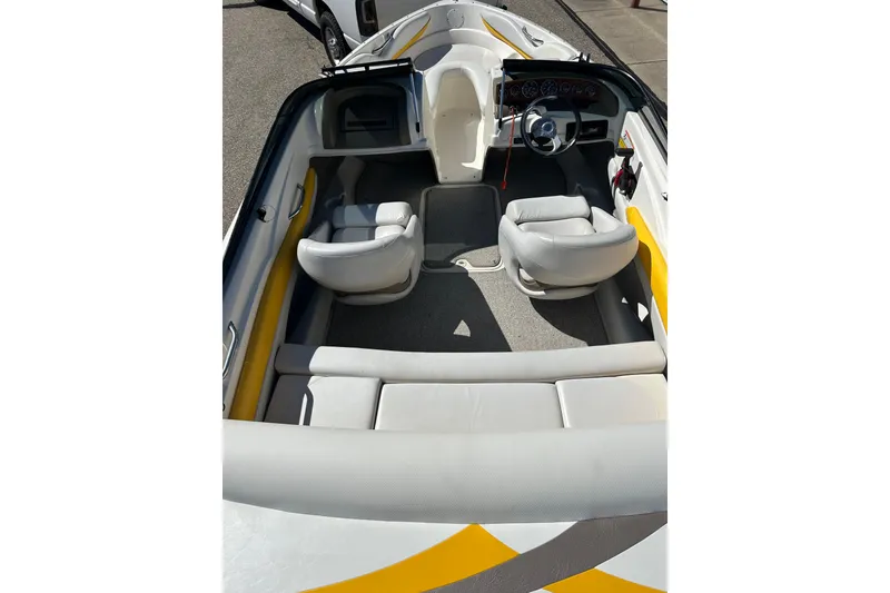 Slide: The Image of 2007 Larson SEi 180 LX I/O boat interior with seating and steering wheel. - 17