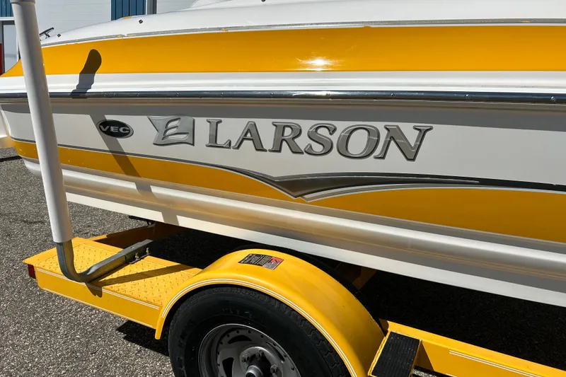 Slide: The Image of Yellow and white 2007 Larson SEi 180 LX I/O boat on trailer. - 3