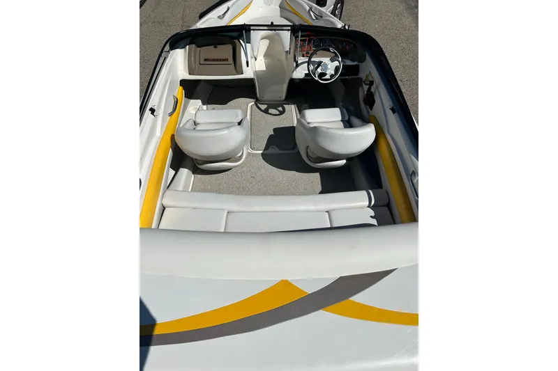 Slide: The Image of 2007 Larson SEi 180 LX I/O boat interior with white and yellow seating. - 6