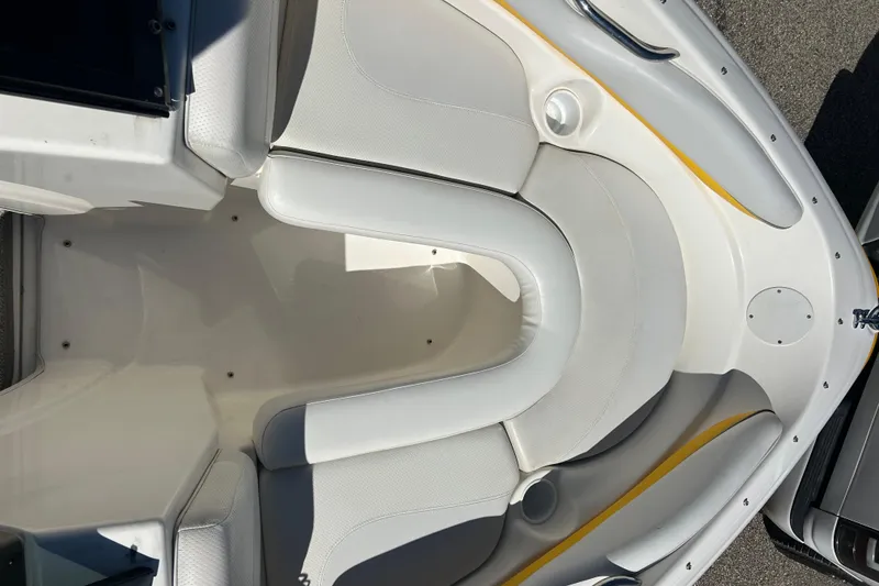 Slide: The Image of 2007 Larson SEi 180 LX I/O boat interior with white cushioned seating. - 9