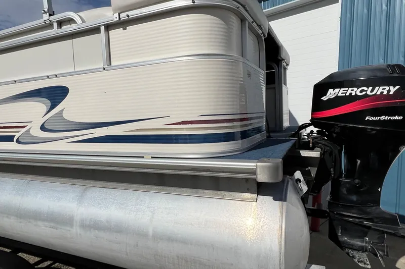 Slide: The Image of 2003 Sylvan 824 Mirage Cruise pontoon boat with Mercury FourStroke outboard motor. - 23