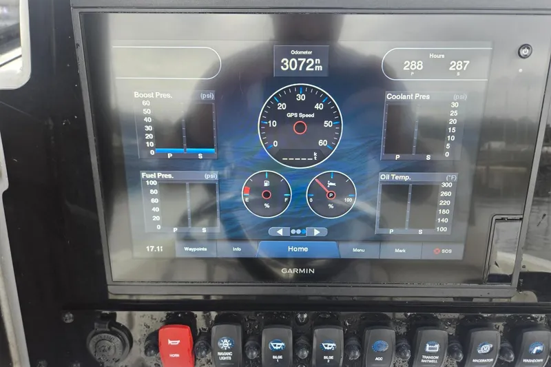 Slide: The Image of Garmin display on 2021 Sea Hunt Gamefish 25 showing odometer, speed, and engine metrics. - 16