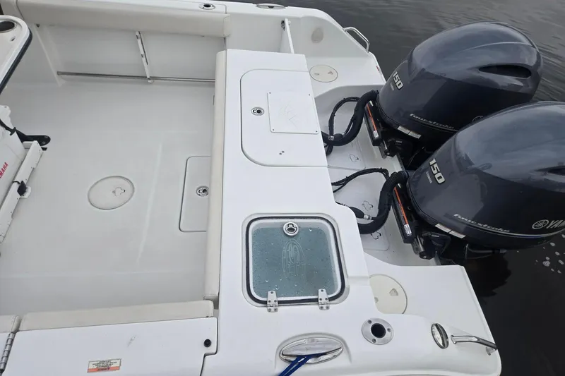 Slide: The Image of 2021 Sea Hunt Gamefish 25 boat with dual Yamaha 150 engines, rear deck view. - 22