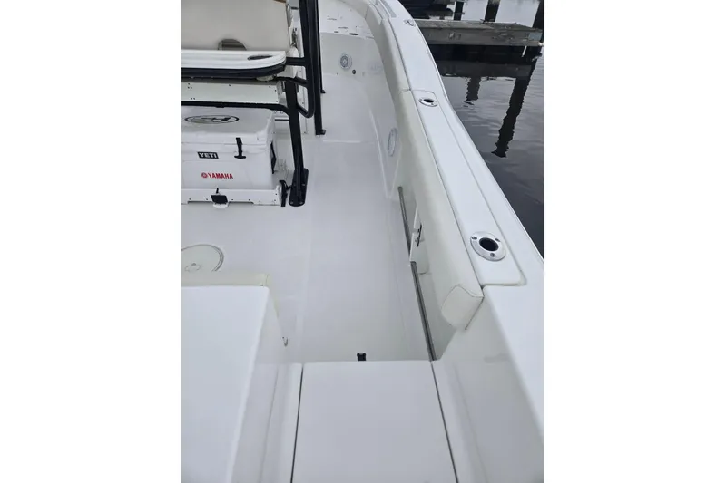 Slide: The Image of 2021 Sea Hunt Gamefish 25 boat interior with Yeti cooler and Yamaha branding. - 25
