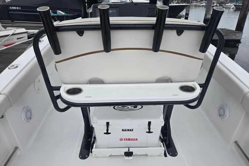 Slide: The Image of 2021 Sea Hunt Gamefish 25 boat interior with rod holders and Yamaha cooler. - 29