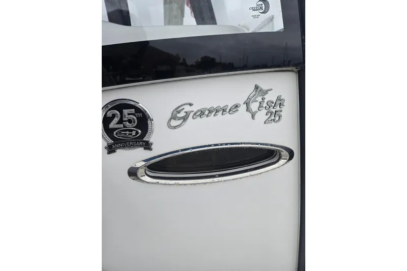Slide: The Image of 2021 Sea Hunt Gamefish 25 boat emblem with 25th anniversary badge. - 30
