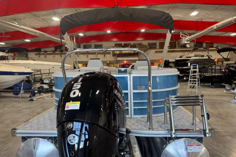Slide: The Image of 2026 Berkshire 24 RFX LE pontoon boat with 150 horsepower engine in showroom. - 6