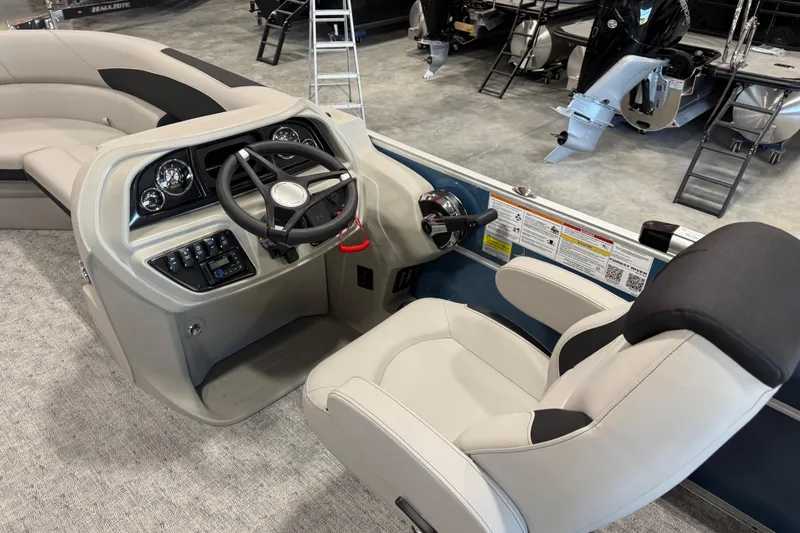 Slide: The Image of 2026 Berkshire 24 RFX LE boat interior with steering console and captain's chair. - 8