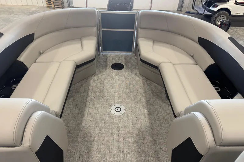 Slide: The Image of 2026 Berkshire 24 RFX LE pontoon boat interior with plush seating and modern design. - 9