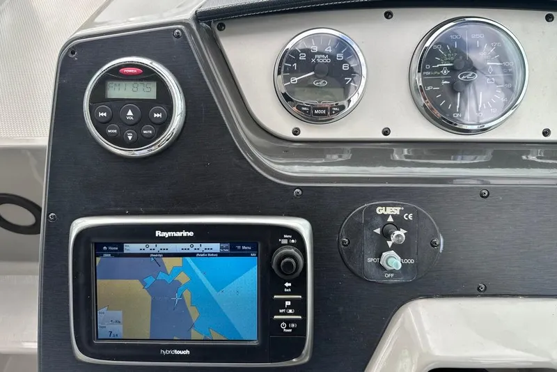 Slide: The Image of Dashboard of 2014 Sea Ray 280 Sundancer with navigation and control instruments. - 10