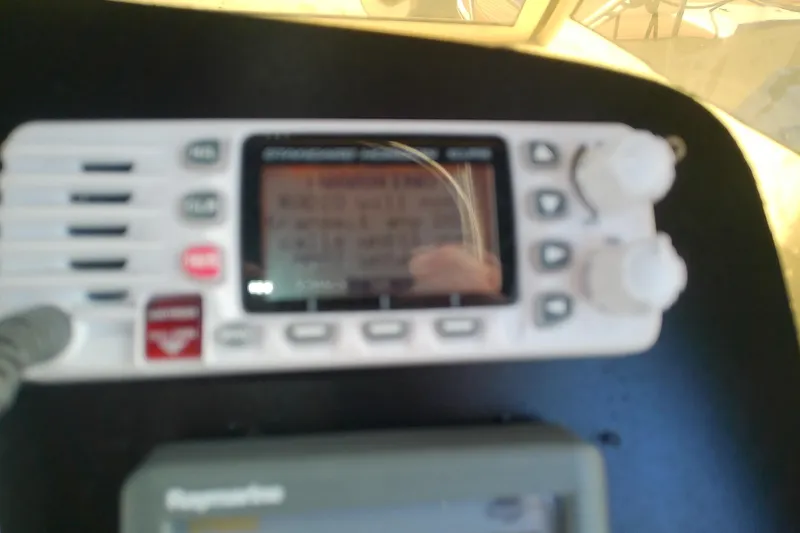 Slide: The Image of Close-up of a marine radio on a 2004 Mainship 34 Pilot II boat. - 19