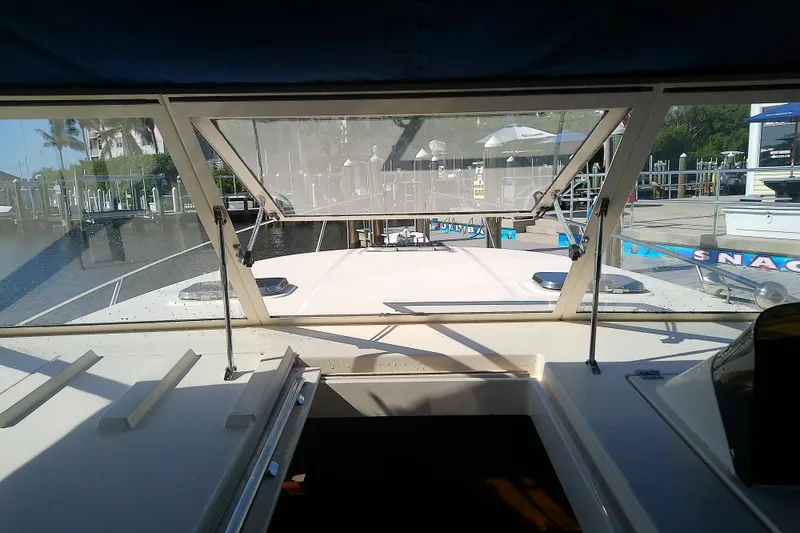 Slide: The Image of 2004 Mainship 34 Pilot II boat interior view at marina dock. - 20