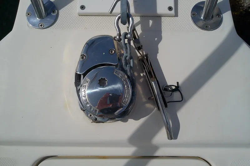 Slide: The Image of Anchor windlass on 2004 Mainship 34 Pilot II boat deck. - 23