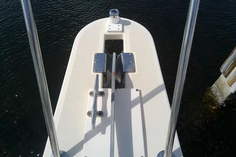 Slide: The Image of Bow of 2004 Mainship 34 Pilot II boat with anchor and railing. - 24