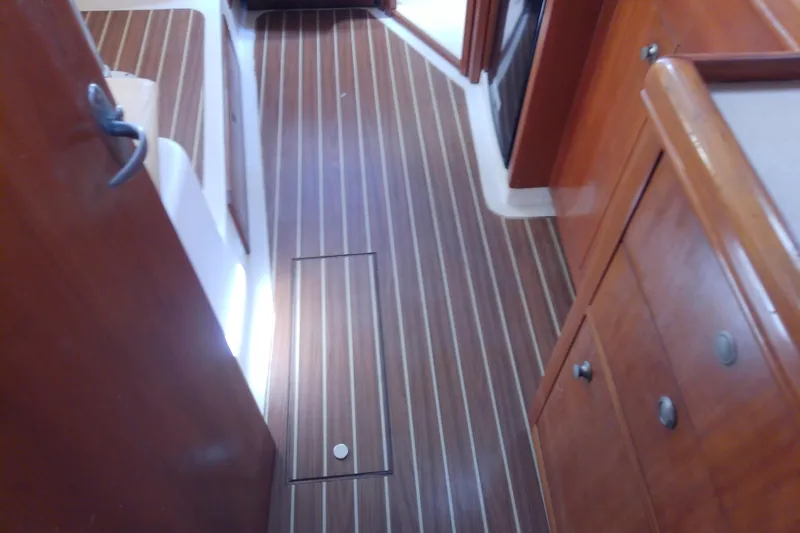 Slide: The Image of 2004 Mainship 34 Pilot II interior with wood flooring and cabinetry. - 37