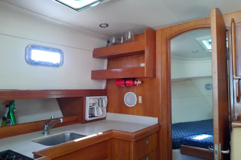 Slide: The Image of 2004 Mainship 34 Pilot II interior with kitchenette and cozy cabin. - 47