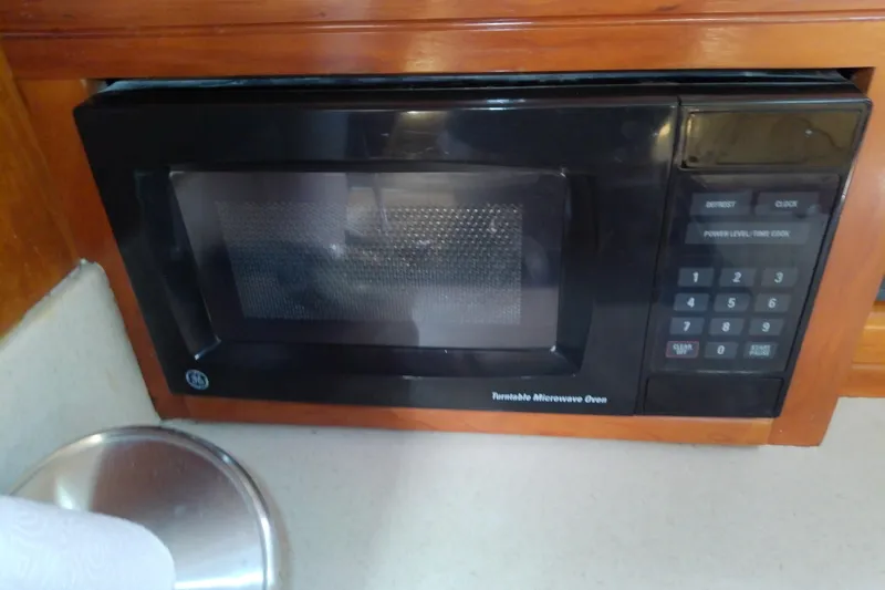Slide: The Image of Microwave oven in 2004 Mainship 34 Pilot II boat kitchen area. - 51