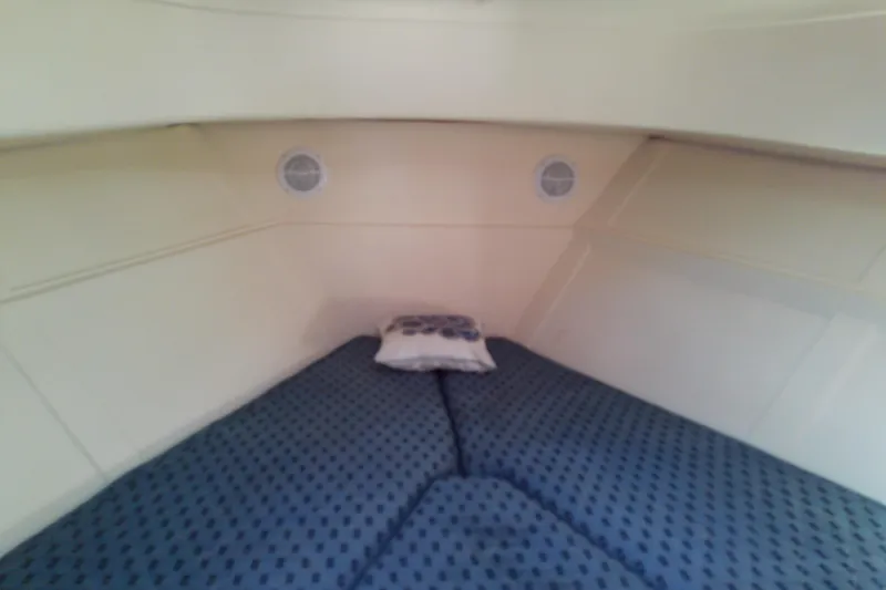 Slide: The Image of 2004 Mainship 34 Pilot II cabin interior with cozy bedding and pillow. - 55