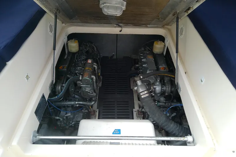 Slide: The Image of Engine compartment of 2004 Mainship 34 Pilot II boat, showcasing dual engines. - 63