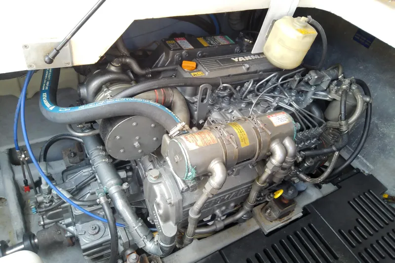 Slide: The Image of Engine compartment of 2004 Mainship 34 Pilot II with Yamaha engine components. - 64