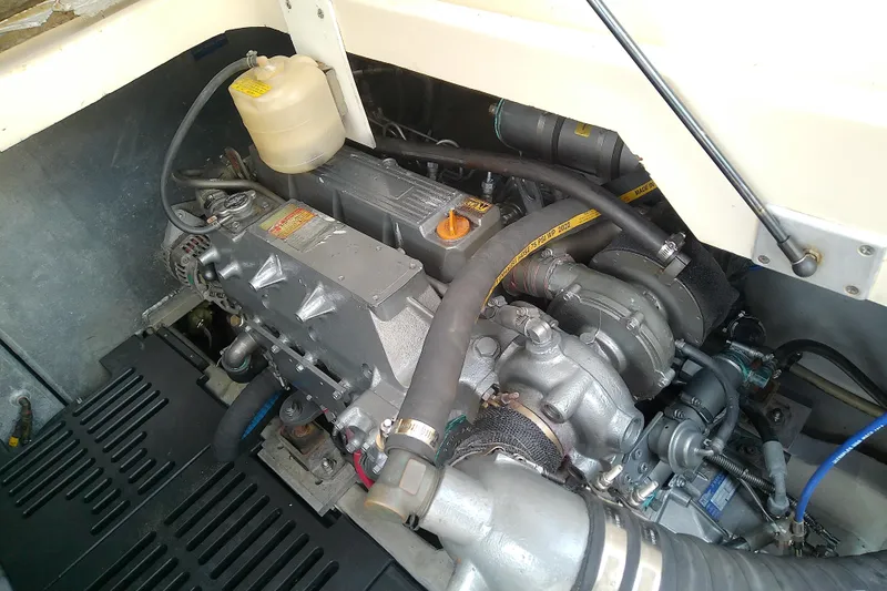 Slide: The Image of Engine compartment of a 2004 Mainship 34 Pilot II boat, showcasing mechanical components. - 65