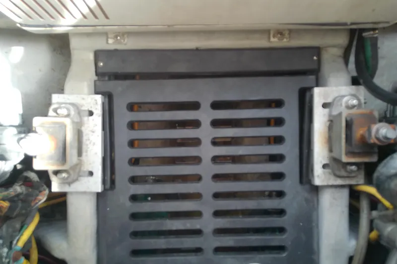 Slide: The Image of Engine compartment of 2004 Mainship 34 Pilot II boat, showing mechanical components and wiring. - 67