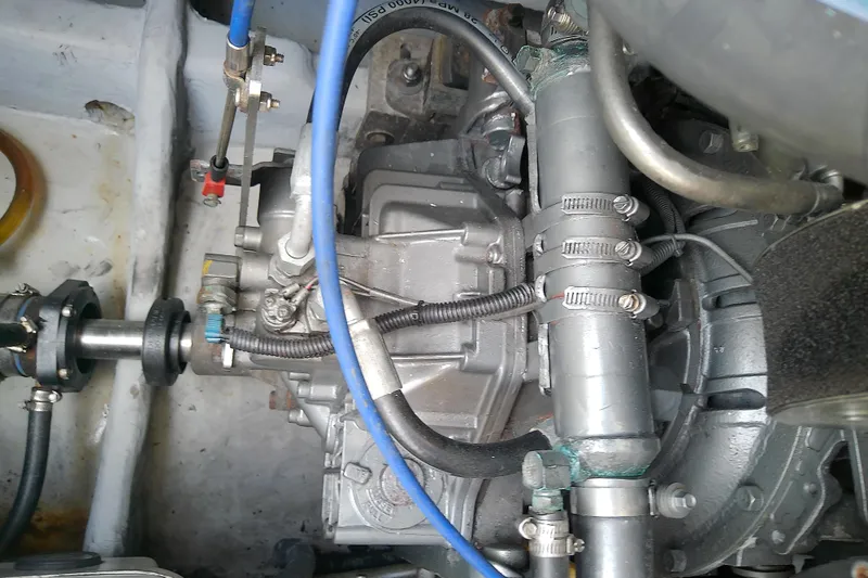 Slide: The Image of Engine compartment of a 2004 Mainship 34 Pilot II boat, showing mechanical components. - 71