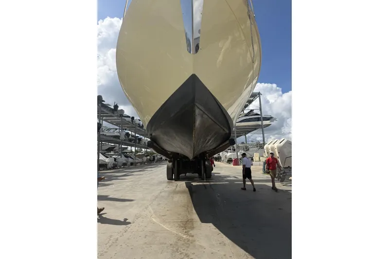 Slide: The Image of 2004 Mainship Pilot 34 Sedan boat on trailer at marina, viewed from below. - 78