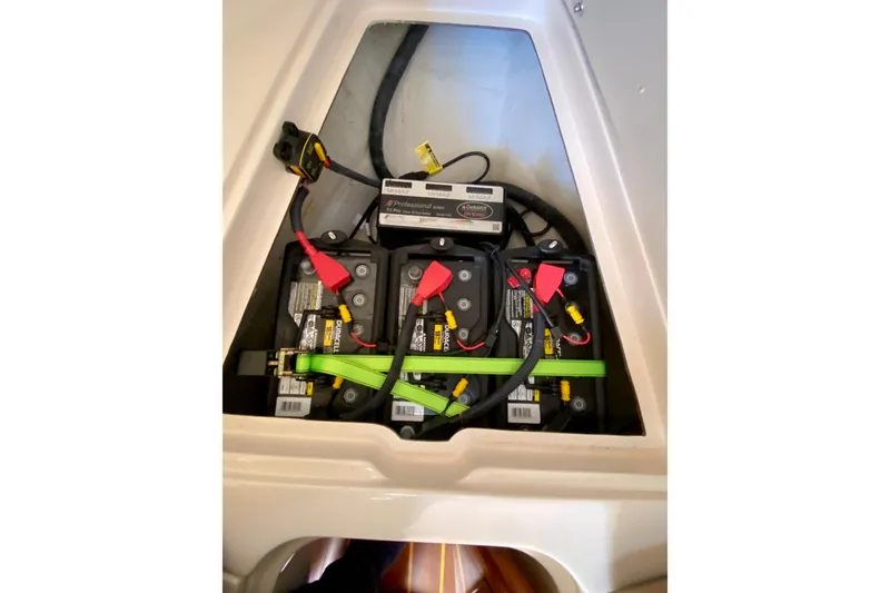 Slide: The Image of 2017 Grady-White Marlin 300 boat battery compartment with Duracell batteries and wiring. - 22