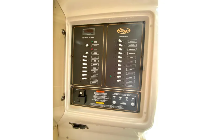 Slide: The Image of Electrical control panel on 2017 Grady-White Marlin 300 boat, featuring AC and DC switches. - 23