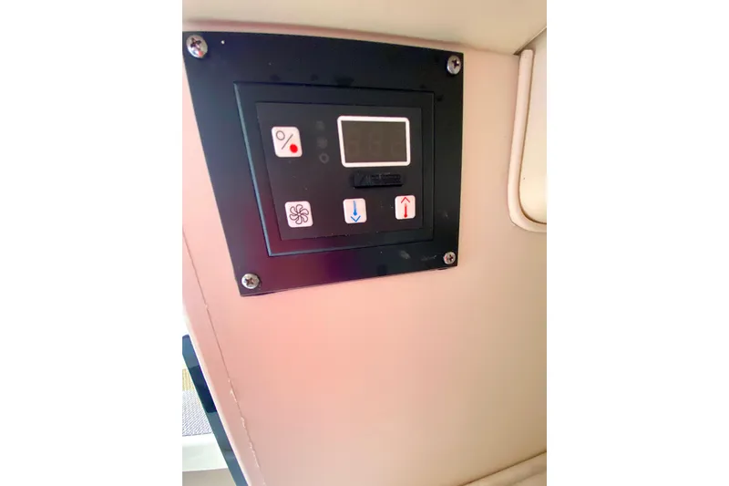 Slide: The Image of Control panel on 2017 Grady-White Marlin 300 boat interior. - 24