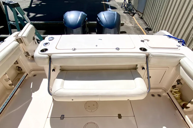 Slide: The Image of 2017 Grady-White Marlin 300 boat interior with seating and dual engines. - 5