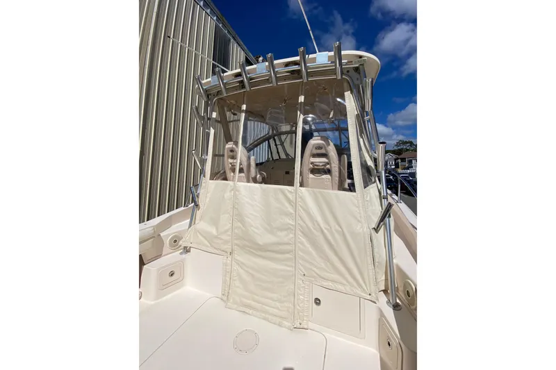 Slide: The Image of 2017 Grady-White Marlin 300 boat with covered cockpit and clear skies. - 7