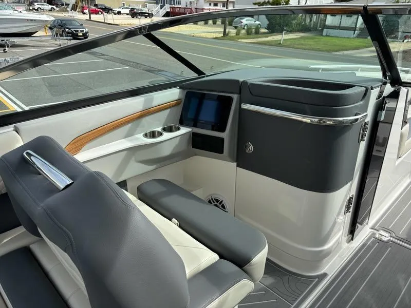 Slide: The Image of 2025 Regal LX9 boat interior with modern dashboard and seating. - 13