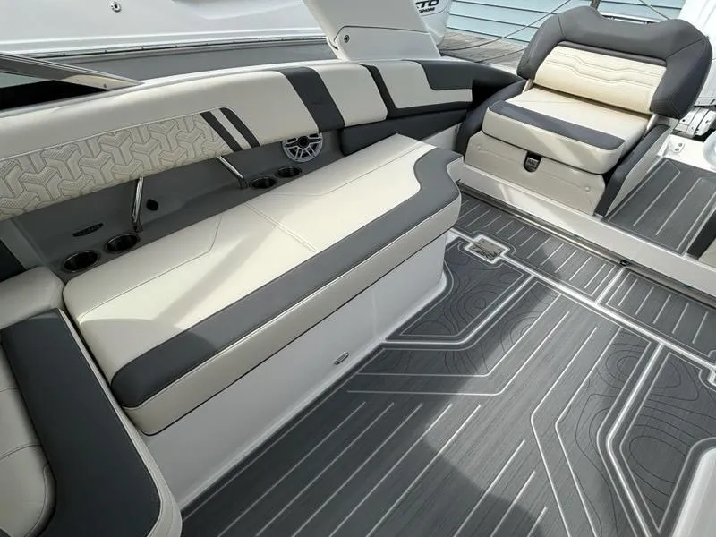 Slide: The Image of 2025 Regal LX9 boat interior with stylish seating and modern flooring design. - 15