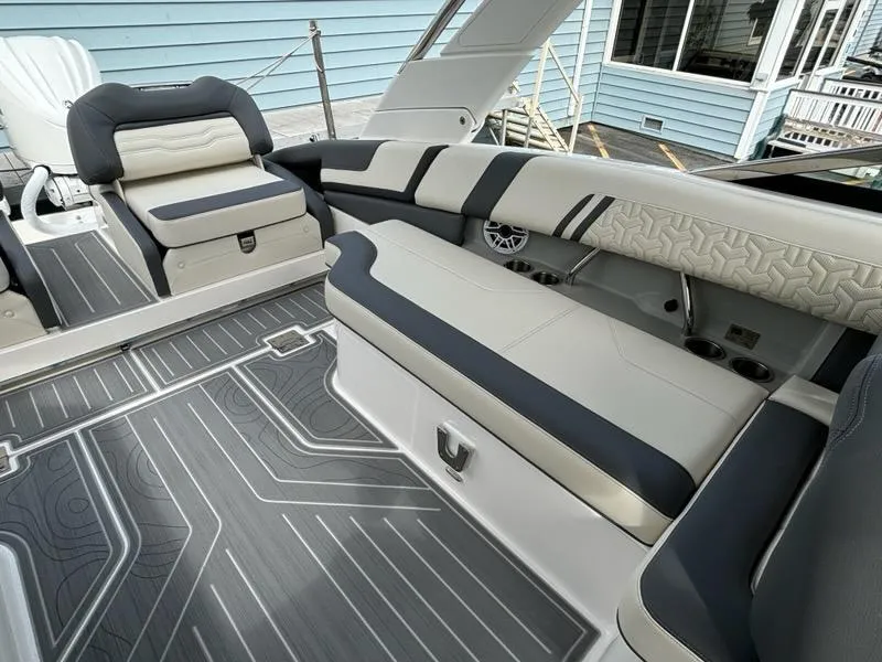 Slide: The Image of 2025 Regal LX9 boat interior with modern seating and sleek design. - 16