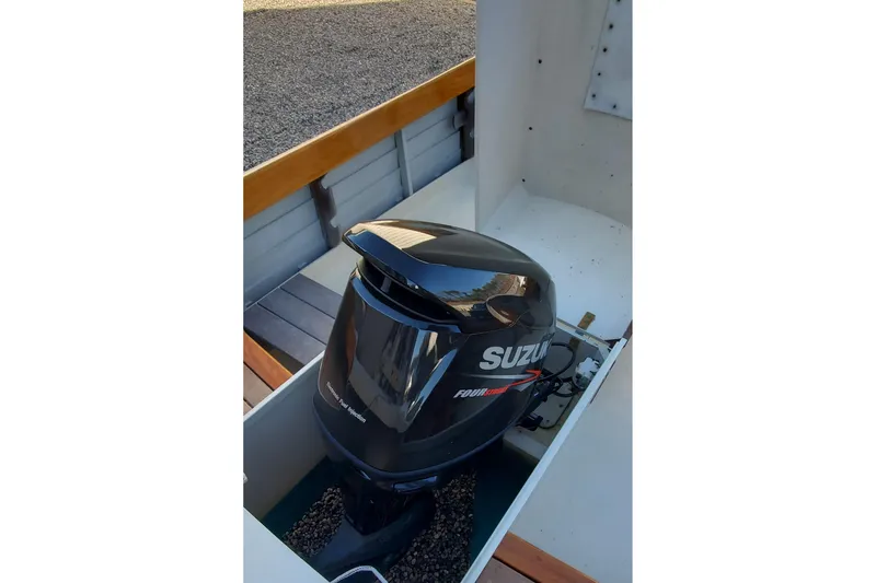 Slide: The Image of Suzuki outboard motor on 2016 First Light Monomoy 26 boat, interior view. - 20