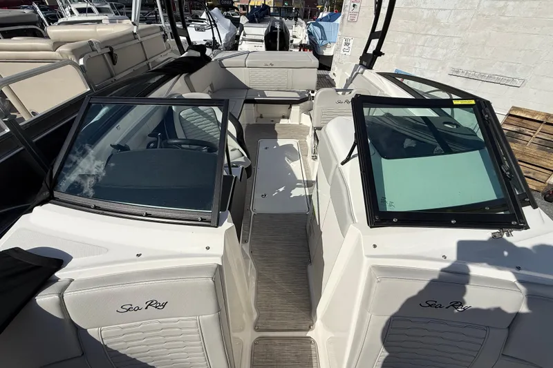 Slide: The Image of 2023 Sea Ray SPX 230 Outboard boat interior with seating and windshield. - 11