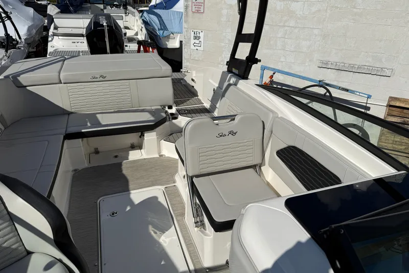 Slide: The Image of 2023 Sea Ray SPX 230 Outboard boat interior with stylish seating and modern design. - 7