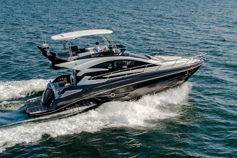 The Image of 2026 Cobrey 52 FLY yacht cruising on open water, showcasing sleek design and luxury. - 0