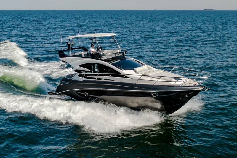 Slide: The Image of Luxury Cobrey 52 FLY yacht cruising on open sea, 2026 model. - 2