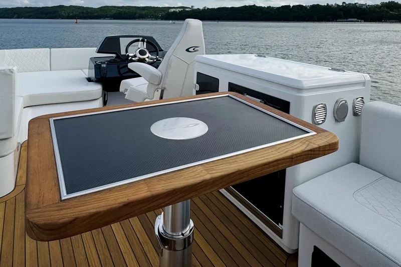 Slide: The Image of Luxurious 2026 Cobrey 52 FLY yacht interior with elegant seating and modern helm. - 6