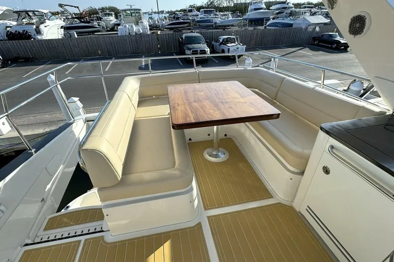 Slide: The Image of Luxurious seating area on 2016 Sea Ray 510 Fly yacht with wooden table. - 23