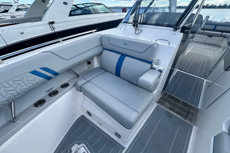 Slide: The Image of 2025 Regal LX36 boat interior with luxurious seating and modern design. - 24