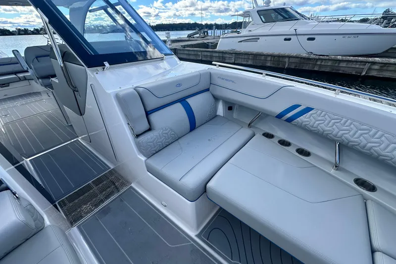 Slide: The Image of Luxurious 2025 Regal LX36 boat interior with sleek seating and modern design. - 25